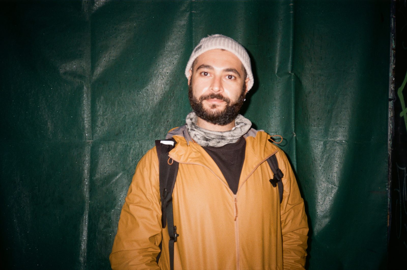 Portrait against green tarp