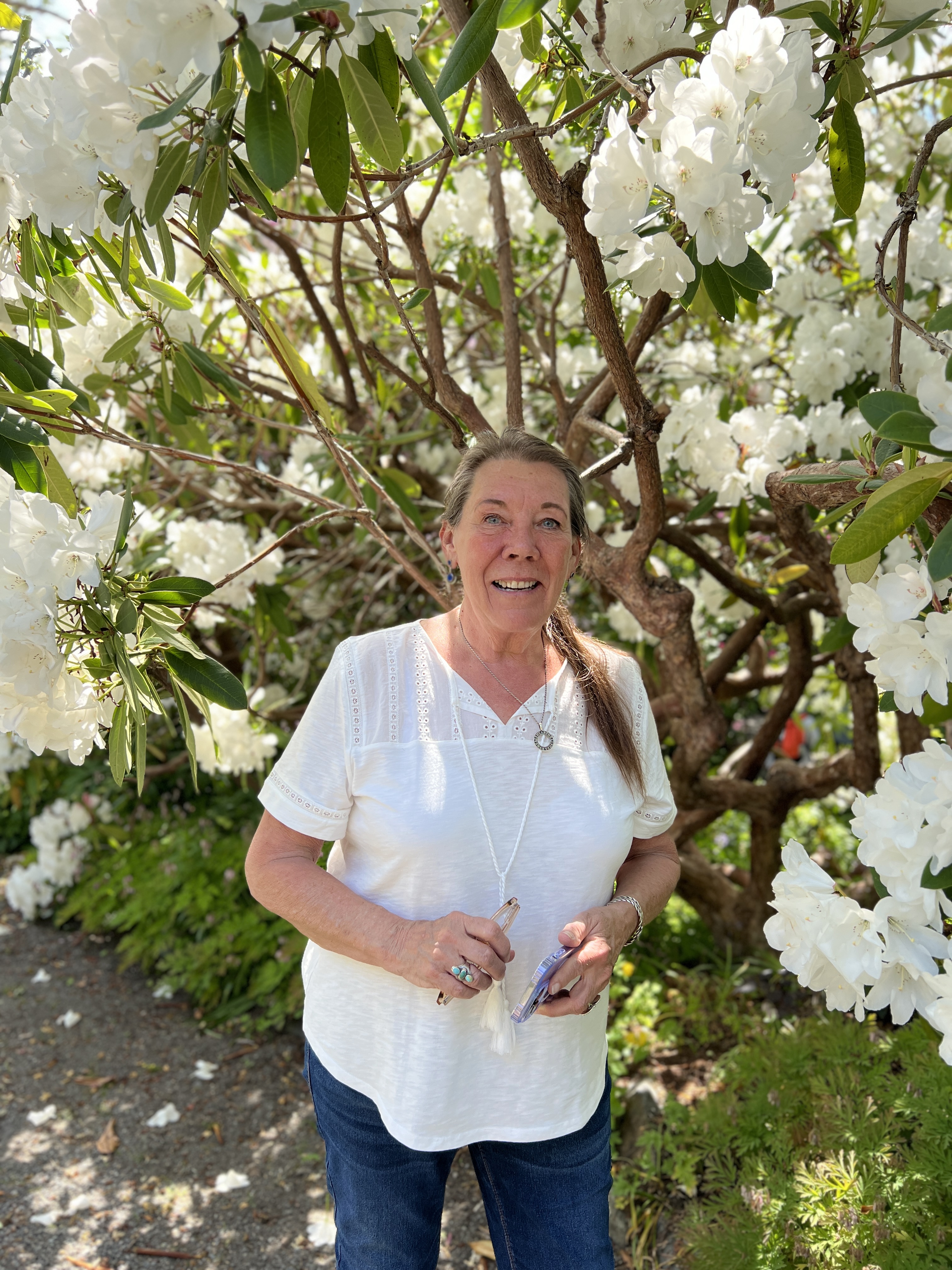 Woman before rhododendron