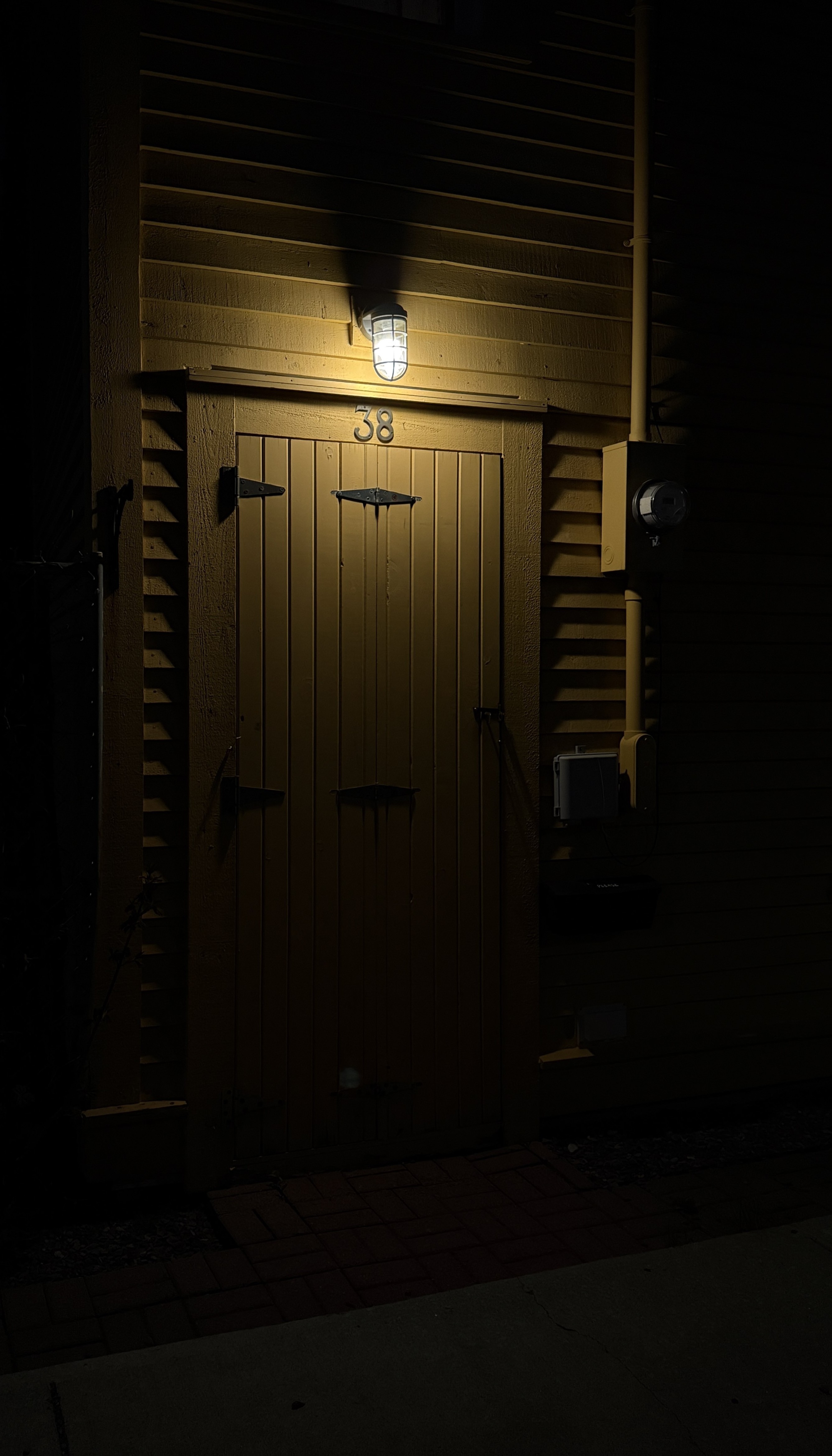 Yellow door 38 at night