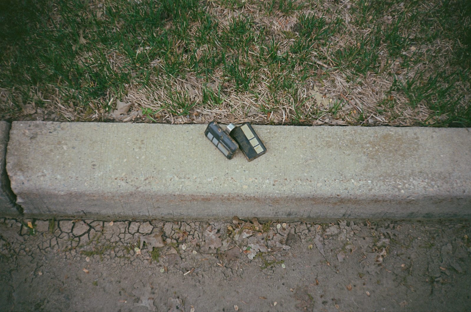 Two lighters on a curb