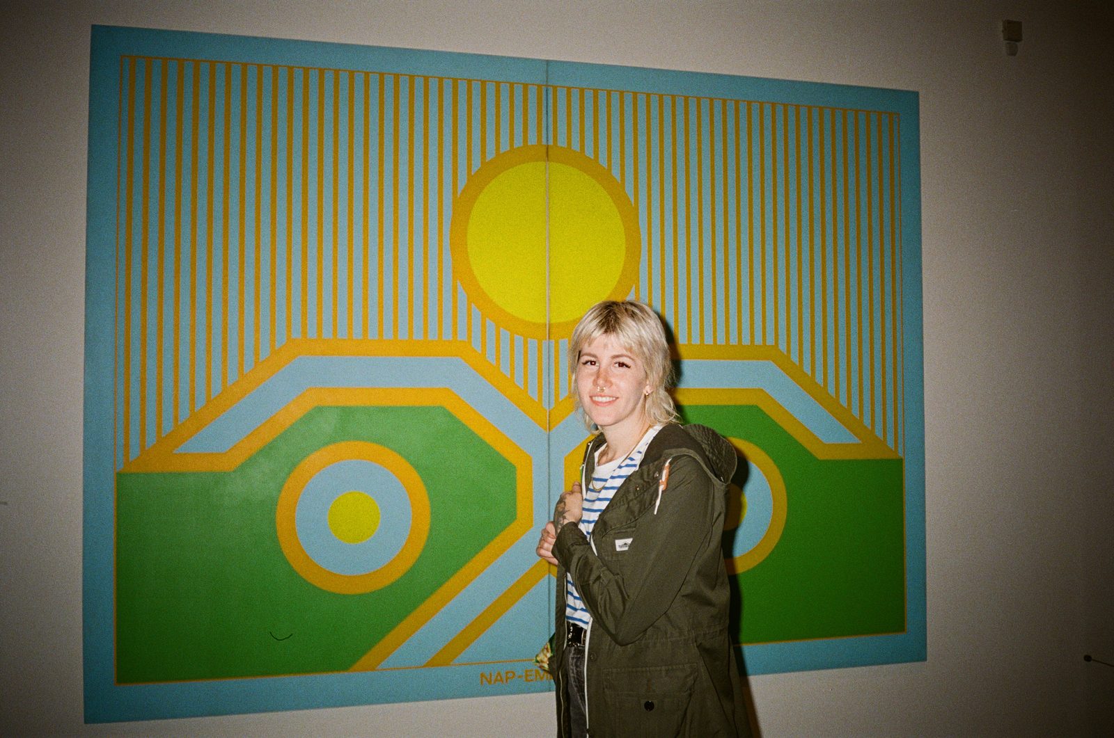 Woman in front of geometric painting